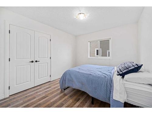 30 Riviera View South, Cochrane, AB - Indoor Photo Showing Bedroom