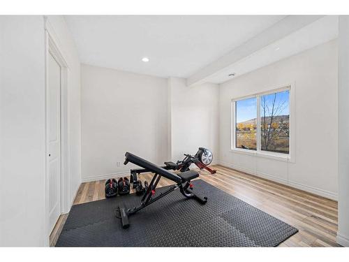 30 Riviera View South, Cochrane, AB - Indoor Photo Showing Gym Room