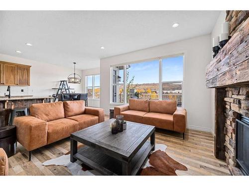 30 Riviera View South, Cochrane, AB - Indoor Photo Showing Living Room With Fireplace