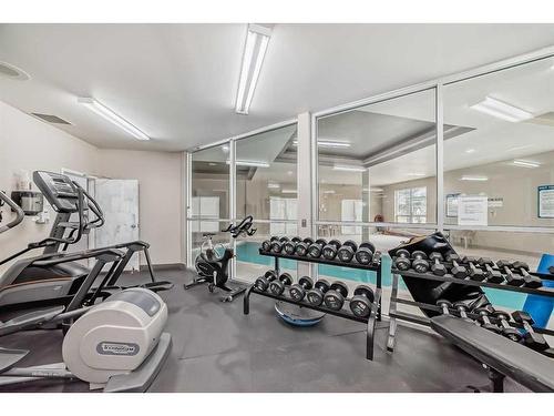 4-121 Village Heights Sw, Calgary, AB - Indoor Photo Showing Gym Room