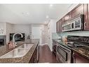 4-121 Village Heights Sw, Calgary, AB  - Indoor Photo Showing Kitchen With Double Sink 