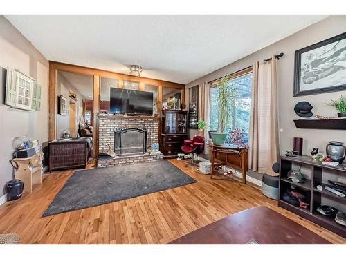 9306 Santana Crescent Nw, Calgary, AB - Indoor Photo Showing Living Room With Fireplace