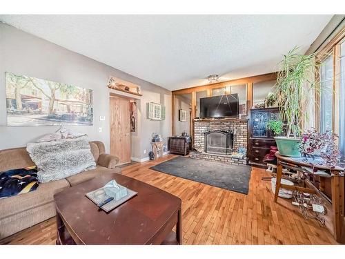 9306 Santana Crescent Nw, Calgary, AB - Indoor Photo Showing Living Room With Fireplace