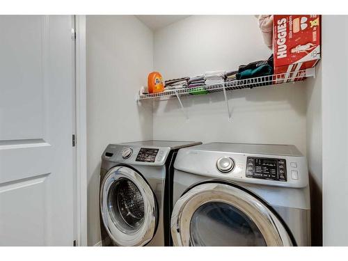 15 Heritage Rise, Cochrane, AB - Indoor Photo Showing Laundry Room