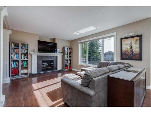 39 Rockcliff Landing Nw, Calgary, AB - Indoor Photo Showing Living Room With Fireplace