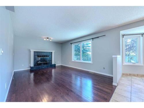 307 Hamptons Mews Nw, Calgary, AB - Indoor Photo Showing Living Room With Fireplace