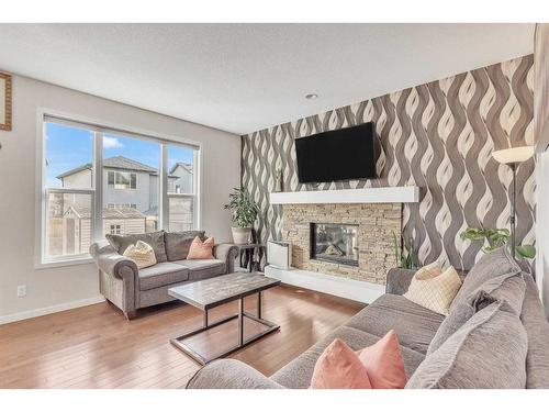 2238 Brightoncrest Common Se, Calgary, AB - Indoor Photo Showing Living Room With Fireplace