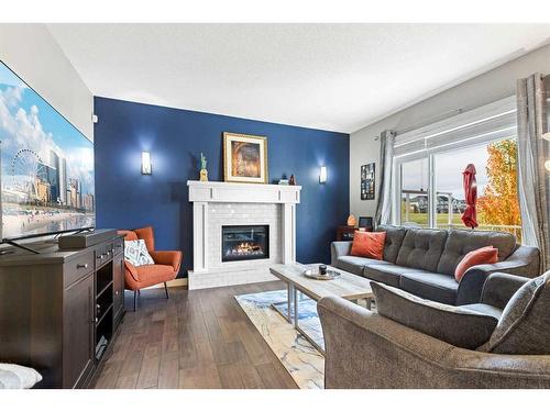 1464 Copperfield Boulevard Se, Calgary, AB - Indoor Photo Showing Living Room With Fireplace