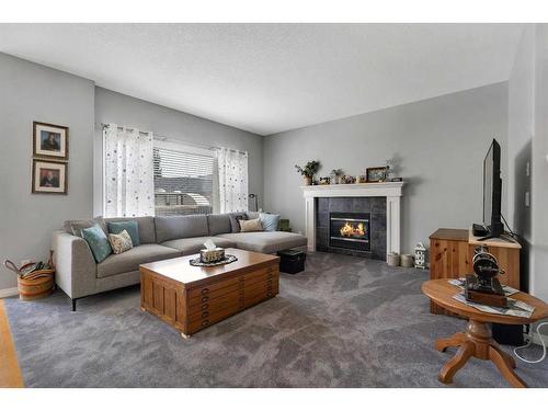 161 West Creek Boulevard, Chestermere, AB - Indoor Photo Showing Living Room With Fireplace