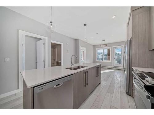 3213-111 Wolf Creek Drive Se, Calgary, AB - Indoor Photo Showing Kitchen With Double Sink With Upgraded Kitchen