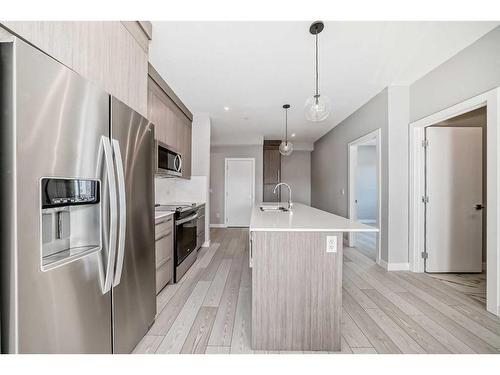 3213-111 Wolf Creek Drive Se, Calgary, AB - Indoor Photo Showing Kitchen With Upgraded Kitchen