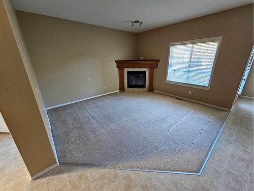 143-100 Coopers Common Sw, Airdrie, AB - Indoor With Fireplace