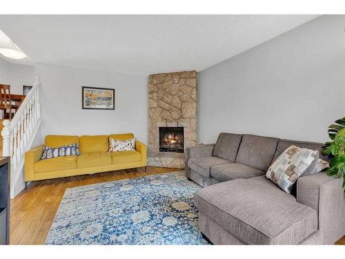 431 Templeview Drive Ne, Calgary, AB - Indoor Photo Showing Living Room With Fireplace