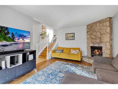 431 Templeview Drive Ne, Calgary, AB - Indoor Photo Showing Living Room With Fireplace