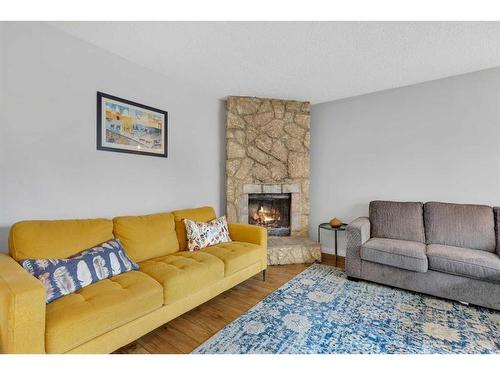 431 Templeview Drive Ne, Calgary, AB - Indoor Photo Showing Living Room With Fireplace