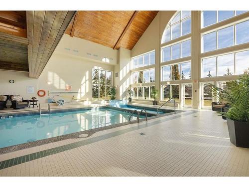 327-6868 Sierra Morena Boulevard Sw, Calgary, AB - Indoor Photo Showing Other Room With In Ground Pool