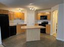 106-160 Panatella Landing Nw, Calgary, AB  - Indoor Photo Showing Kitchen With Double Sink 