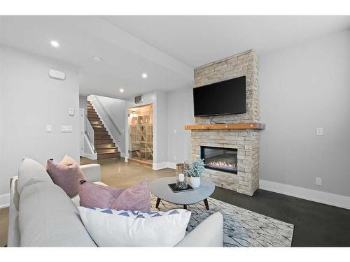 826 Durham Avenue Sw, Calgary, AB - Indoor Photo Showing Living Room With Fireplace