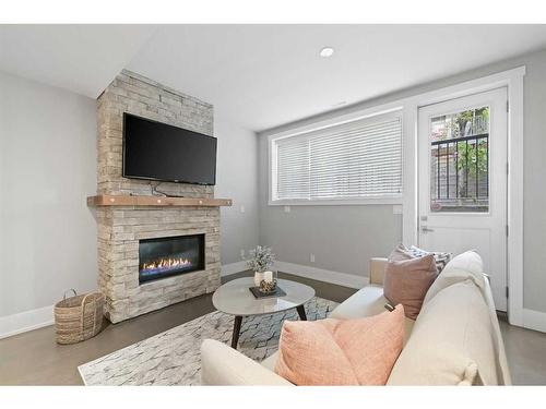 826 Durham Avenue Sw, Calgary, AB - Indoor Photo Showing Living Room With Fireplace