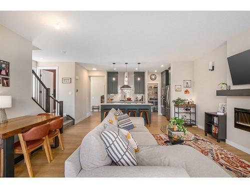 72 Cranbrook Manor Se, Calgary, AB - Indoor Photo Showing Living Room With Fireplace