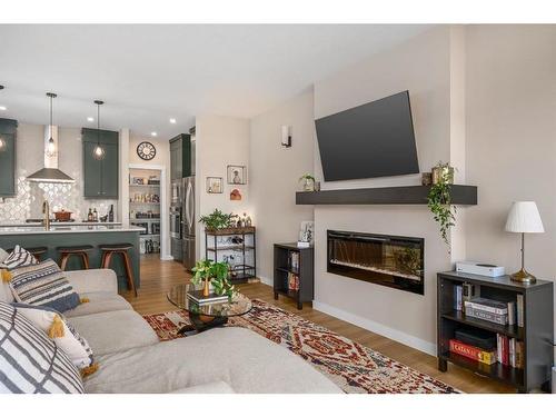 72 Cranbrook Manor Se, Calgary, AB - Indoor Photo Showing Living Room With Fireplace