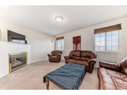 1 Royal Elm Way Nw, Calgary, AB - Indoor Photo Showing Living Room With Fireplace