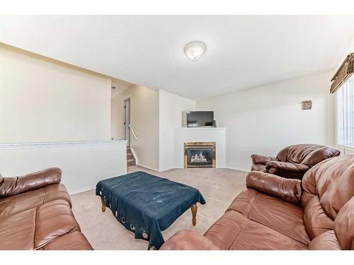 1 Royal Elm Way Nw, Calgary, AB - Indoor Photo Showing Living Room With Fireplace