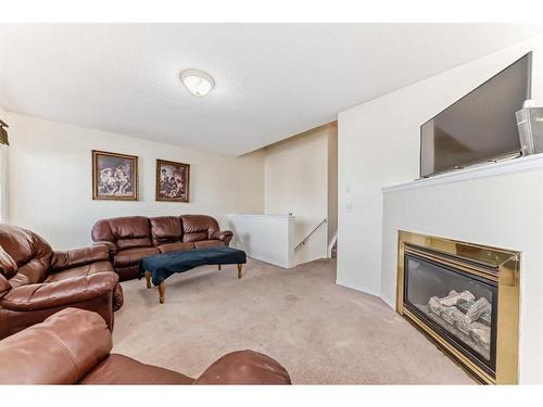 1 Royal Elm Way Nw, Calgary, AB - Indoor Photo Showing Living Room With Fireplace