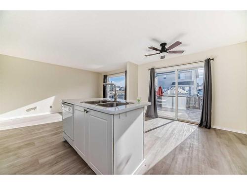 1 Royal Elm Way Nw, Calgary, AB - Indoor Photo Showing Kitchen With Double Sink