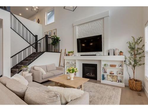 55 Walcrest View Se, Calgary, AB - Indoor Photo Showing Living Room With Fireplace