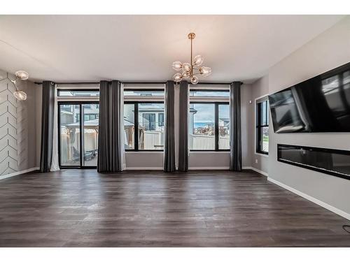 11 West Grove Common Sw, Calgary, AB - Indoor Photo Showing Living Room With Fireplace