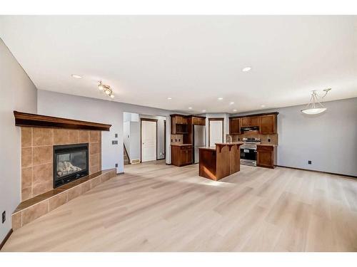 455 Cranston Drive Se, Calgary, AB - Indoor Photo Showing Living Room With Fireplace