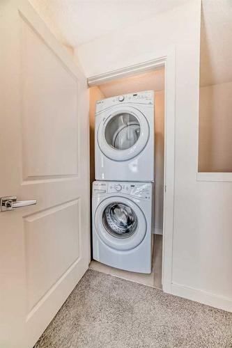 90 Sherwood Row Nw, Calgary, AB - Indoor Photo Showing Laundry Room