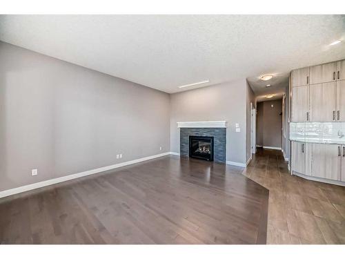 558 Sherwood Boulevard Nw, Calgary, AB - Indoor Photo Showing Living Room With Fireplace