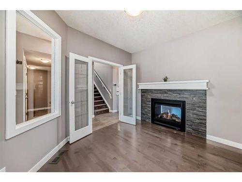 558 Sherwood Boulevard Nw, Calgary, AB - Indoor Photo Showing Living Room With Fireplace