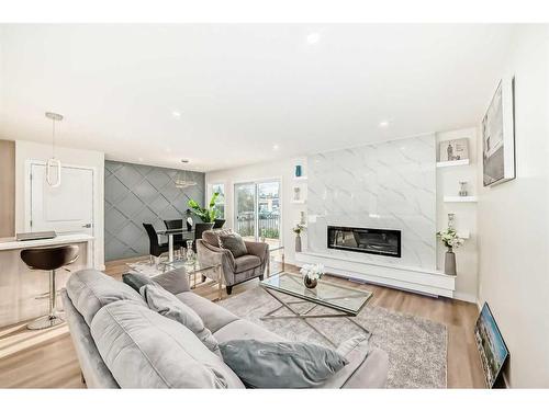 103 Olympia Drive Se, Calgary, AB - Indoor Photo Showing Living Room With Fireplace