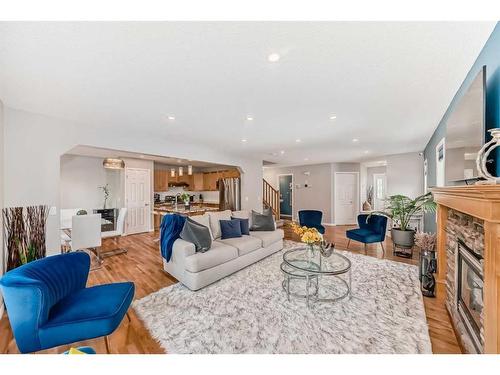 2 Evansbrooke Manor Nw, Calgary, AB - Indoor Photo Showing Living Room With Fireplace