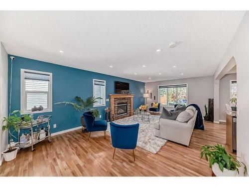 2 Evansbrooke Manor Nw, Calgary, AB - Indoor Photo Showing Living Room With Fireplace