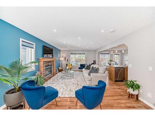 2 Evansbrooke Manor Nw, Calgary, AB - Indoor Photo Showing Living Room With Fireplace