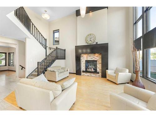 245 Chapalina Mews Se, Calgary, AB - Indoor Photo Showing Living Room With Fireplace