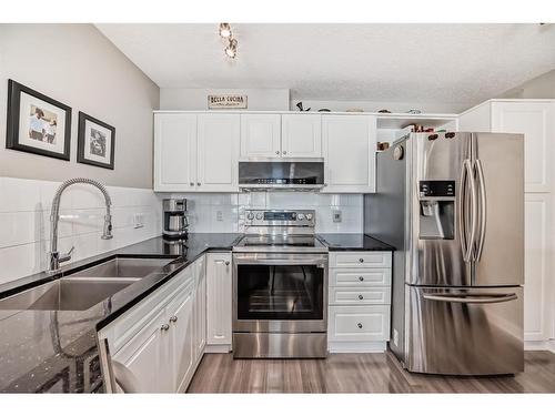 312-20 Sierra Morena Mews Sw, Calgary, AB - Indoor Photo Showing Kitchen With Stainless Steel Kitchen With Double Sink With Upgraded Kitchen