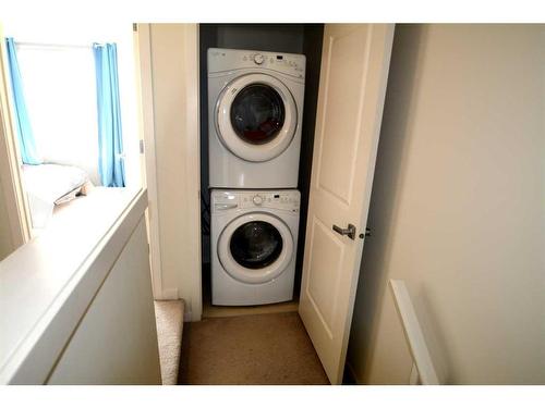 65 Walden Se, Calgary, AB - Indoor Photo Showing Laundry Room