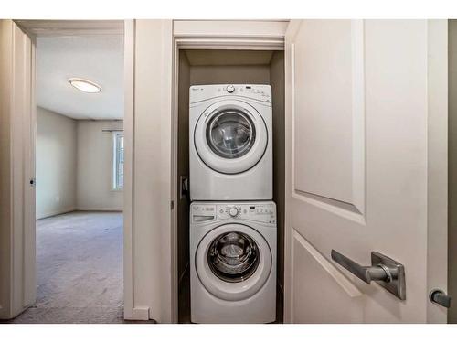 65 Walden Walk Se, Calgary, AB - Indoor Photo Showing Laundry Room