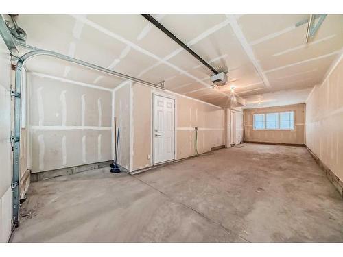 65 Walden Walk Se, Calgary, AB - Indoor Photo Showing Garage