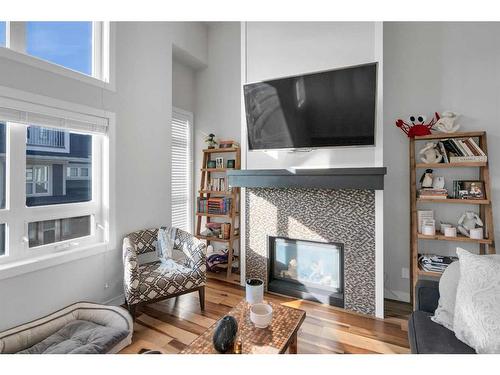 159 Silverado Plains Park Sw, Calgary, AB - Indoor Photo Showing Living Room With Fireplace