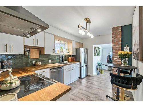 2023 8 Avenue Se, Calgary, AB - Indoor Photo Showing Kitchen With Double Sink