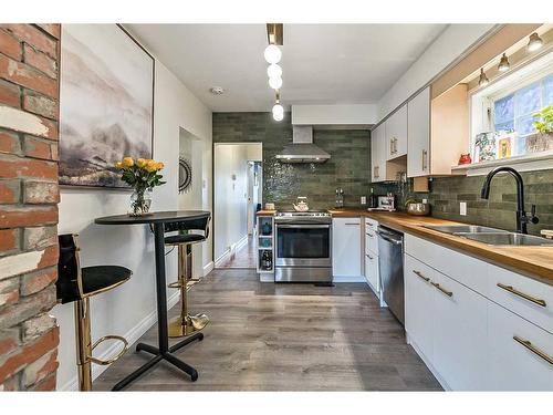 2023 8 Avenue Se, Calgary, AB - Indoor Photo Showing Kitchen With Stainless Steel Kitchen With Double Sink