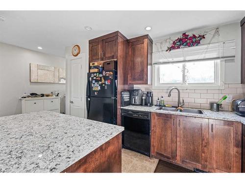 2-131 Templehill Drive Ne, Calgary, AB - Indoor Photo Showing Kitchen With Double Sink