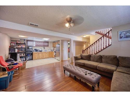 36 Taylor Way Se, Airdrie, AB - Indoor Photo Showing Living Room