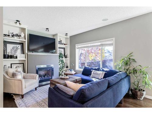 264 Brightonwoods Gardens Se, Calgary, AB - Indoor Photo Showing Living Room With Fireplace